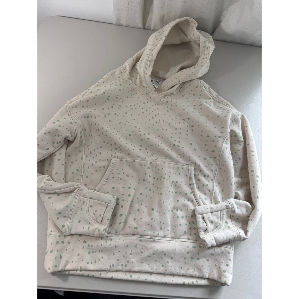 Athleta Girl Retroplush Hoodie in a white and green spotted pattern.